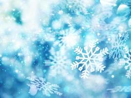 Abstract glowing Christmas blue background with snowflakes photo