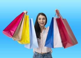 Happy woman with shopping bags in hand photo