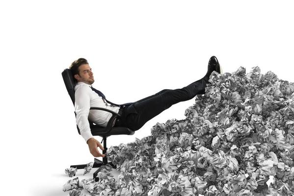 Businessman with paper sheet anywhere. Buried by bureaucracy. Concept of overwork