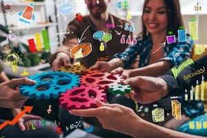 Teamwork of business people work together and combine pieces of gears photo