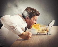 Angry businessman spits fire photo