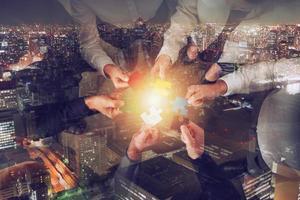 Teamwork of partners. Concept of integration and startup with puzzle pieces photo