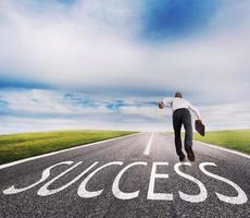 Man runs on a success way. Concept of successful businessman and company startup photo