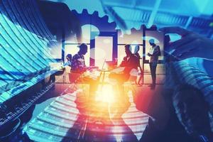 Business team connect pieces of gears. Teamwork, partnership and integration concept. double exposure with light effects photo