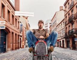 Deliveryman runs fast with a toy car to deliver pizza photo