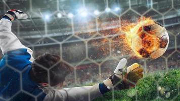 Goalkeeper catches a fast fiery soccer ball photo