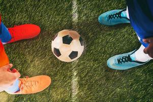 Two soccer players challenge each other at the stadium photo