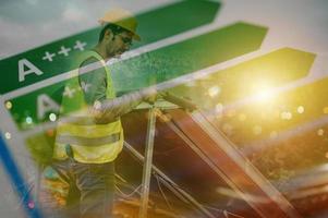 Man works on renewable energy system with solar panel for hot water photo