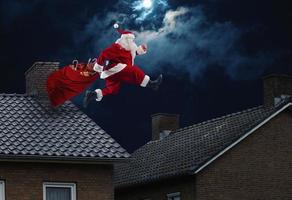 Santa claus ready to deliver presents for christmas photo