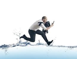 Businessman run on the water photo