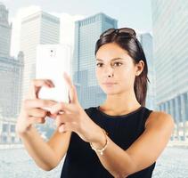 Woman photographs the city photo