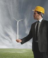 Businessman and wind turbine photo