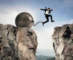 Businessman overcomes obstacles photo
