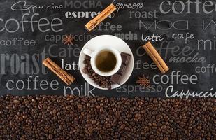 Background of cup coffee beans with cinnamon and anise photo