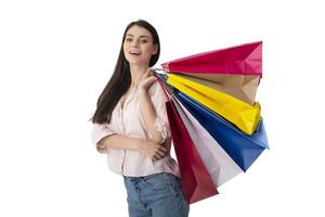 Happy woman with shopping bags in hand. Isolated on white background. photo