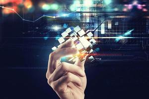 Innovation in the digital world. Hand holds abstract cubes. 3D Rendering photo