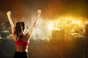 Athletic woman on city background photo