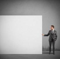 Businessman holds a blank billboard photo