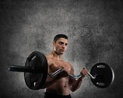 Athletic man training biceps photo