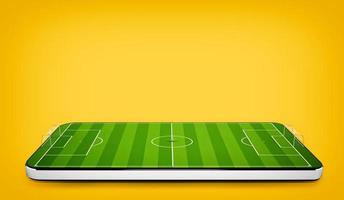 Mobile phone on yellow background with football field on the screen. 3D Rendering photo