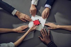 Teamwork of partners. Concept of integration and startup with puzzle pieces photo