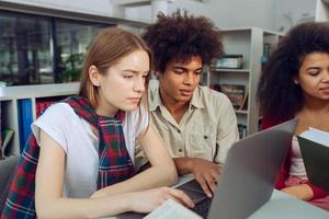 University students are studying in a library together. Concept of teamwork and preparation photo