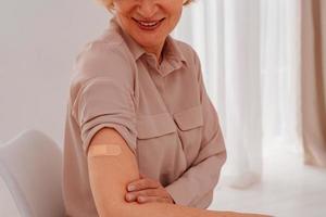 Patient with patch on the arm did the covid-19 vaccine photo