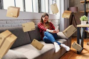 Woman does shopping through e-commerce online shop. Concept of fast delivery photo