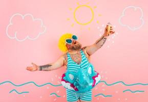 Fat man with beard and life buoy for children eats an icecream photo