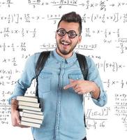 Nerd boy studying in classroom for math photo