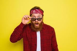 Wondered man with beard and bandana in head photo