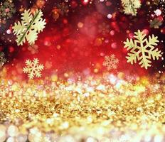 Abstract glowing Christmas gold and red background with snowflakes photo