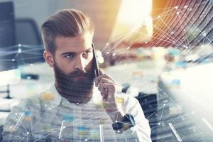 Businessman talking to the phone in office with internet network effects. double exposure photo