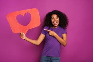 Woman is happy because receives hearts on social network photo