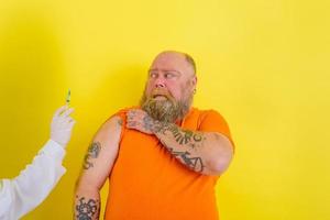 Afraid man is afraid of getting the covid-19 vaccine photo