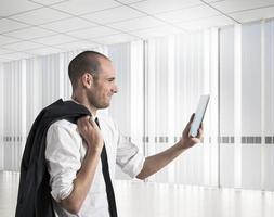 Businessman looks results to mobile photo