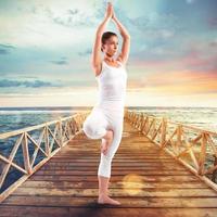 Exercises of gymnastics on a pier photo