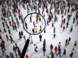 Magnifying glass on a large group of people. 3D Rendering photo