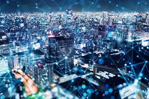 Fast connection in the city at night. Abstract technology background photo