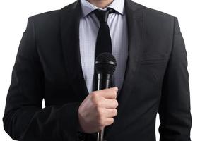 elegant Businessman ready to speak with microphone photo