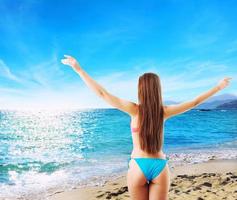 Woman in bikini starts holiday. concept of freedom and relax photo