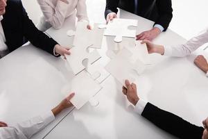 Teamwork of partners. Concept of integration and startup with puzzle pieces photo