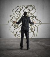 Businessman resolves the tangle photo