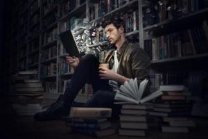 Boy reads a book in a library. Concept of curiosity, imagination and culture photo