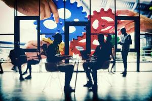 Business team connect pieces of gears. Teamwork, partnership and integration concept. double exposure with light effects photo