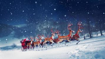 Santa claus in a sleigh ready to deliver presents with sleigh photo
