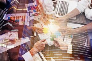 Business people join puzzle pieces in office. Concept of teamwork and partnership. double exposure with light effects photo