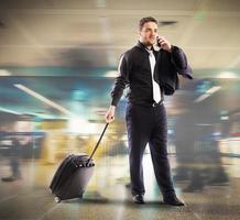 Busy businessman in airport photo