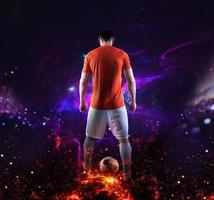 Football scene with soccer player in front of a futuristic digital background photo