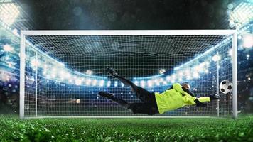 fútbol portero, en fluorescente uniforme, ese hace un genial salvar y evita un objetivo durante un partido a el estadio foto